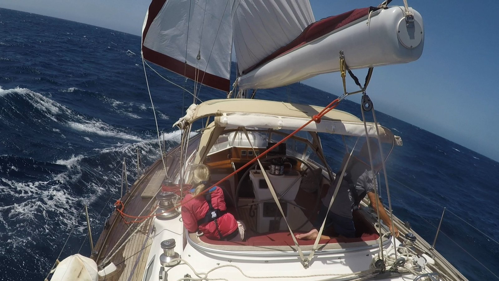 Sailing boat setting genoa